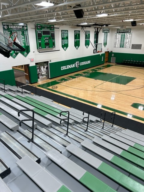 runners and mats protect the court at Coleman High School