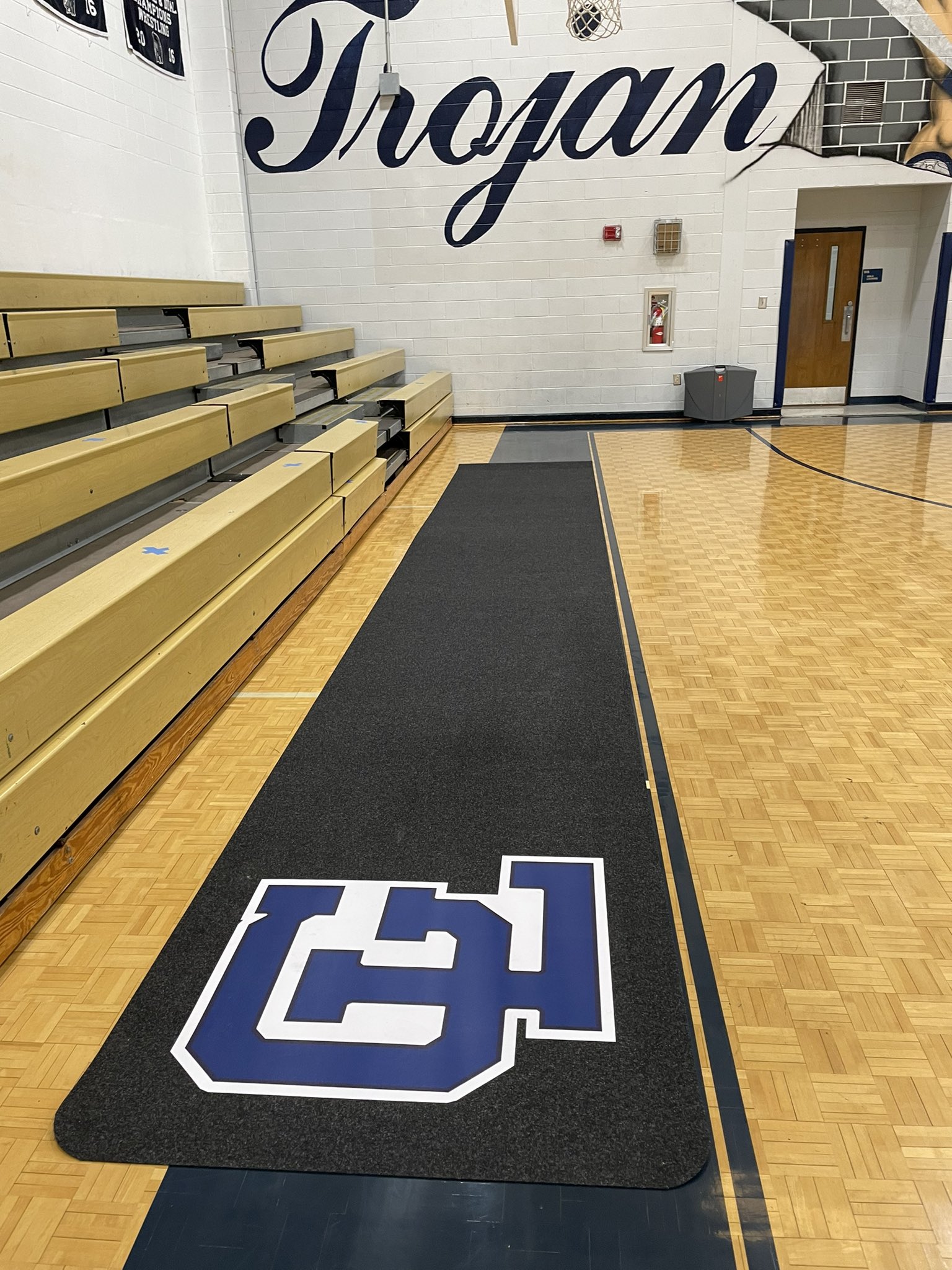 courtside runners in basketball gym for GLMS with brilliant logos