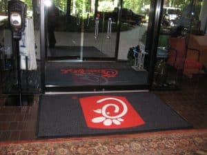 entryway mat with custom logo at Chick Fil A corporate building