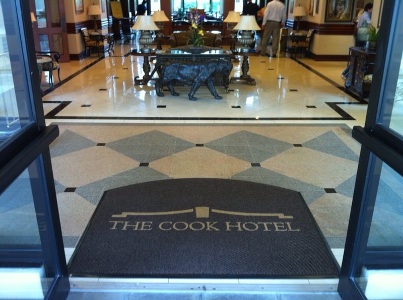 custom logo floor mats make a grand impression of your branding at the front door. Check out the Cook's Hotel